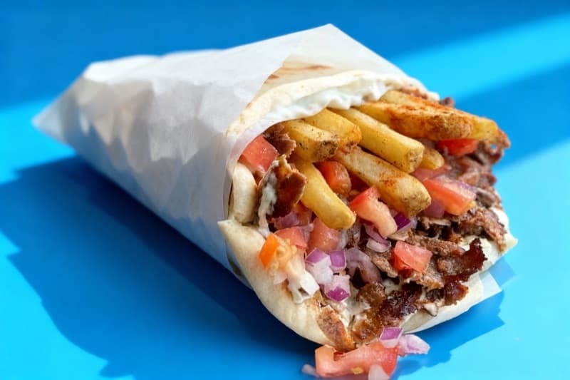 After: Gyro wrap transformed from casual tray to vibrant blue backdrop