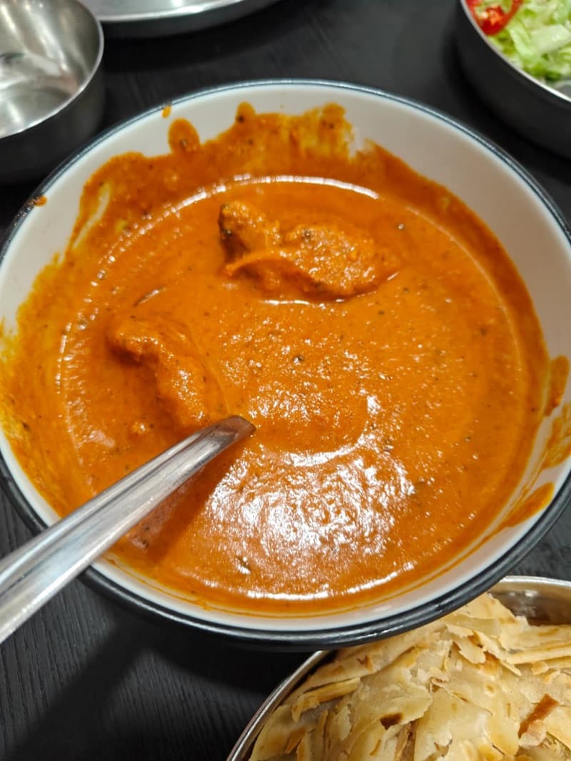 Before: Butter chicken transformed from crowded table to marble surface