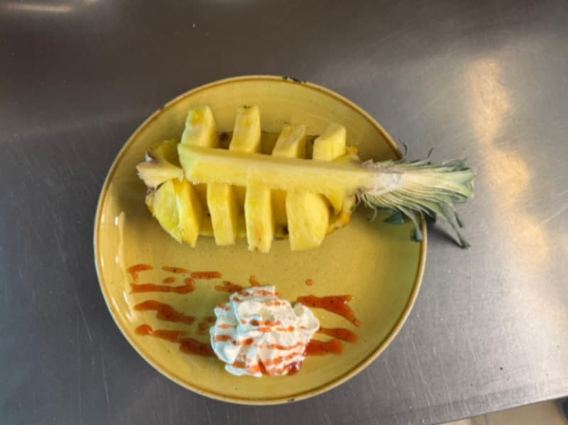 Before: Pineapple boat dessert with whipped cream