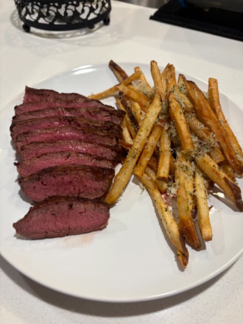 Before: Steak and fries transformed from dark kitchen to bold red backdrop